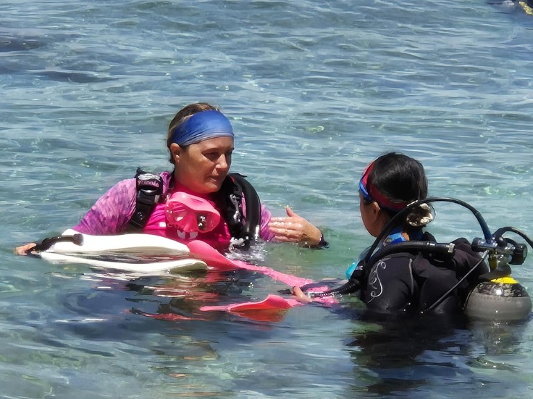 Group of women on a female-only scuba diving trip with Rise and Dive