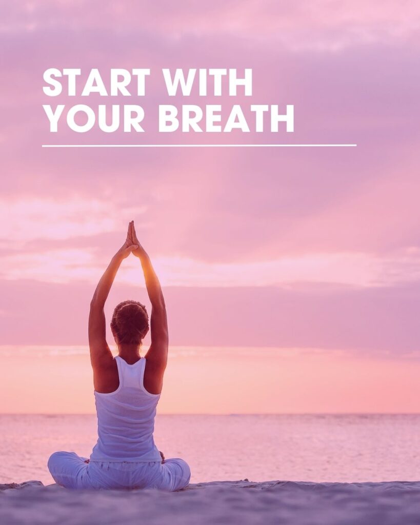 Woman practicing breathing exercises on the beach to overcome dive anxiety and build scuba diving confidence
