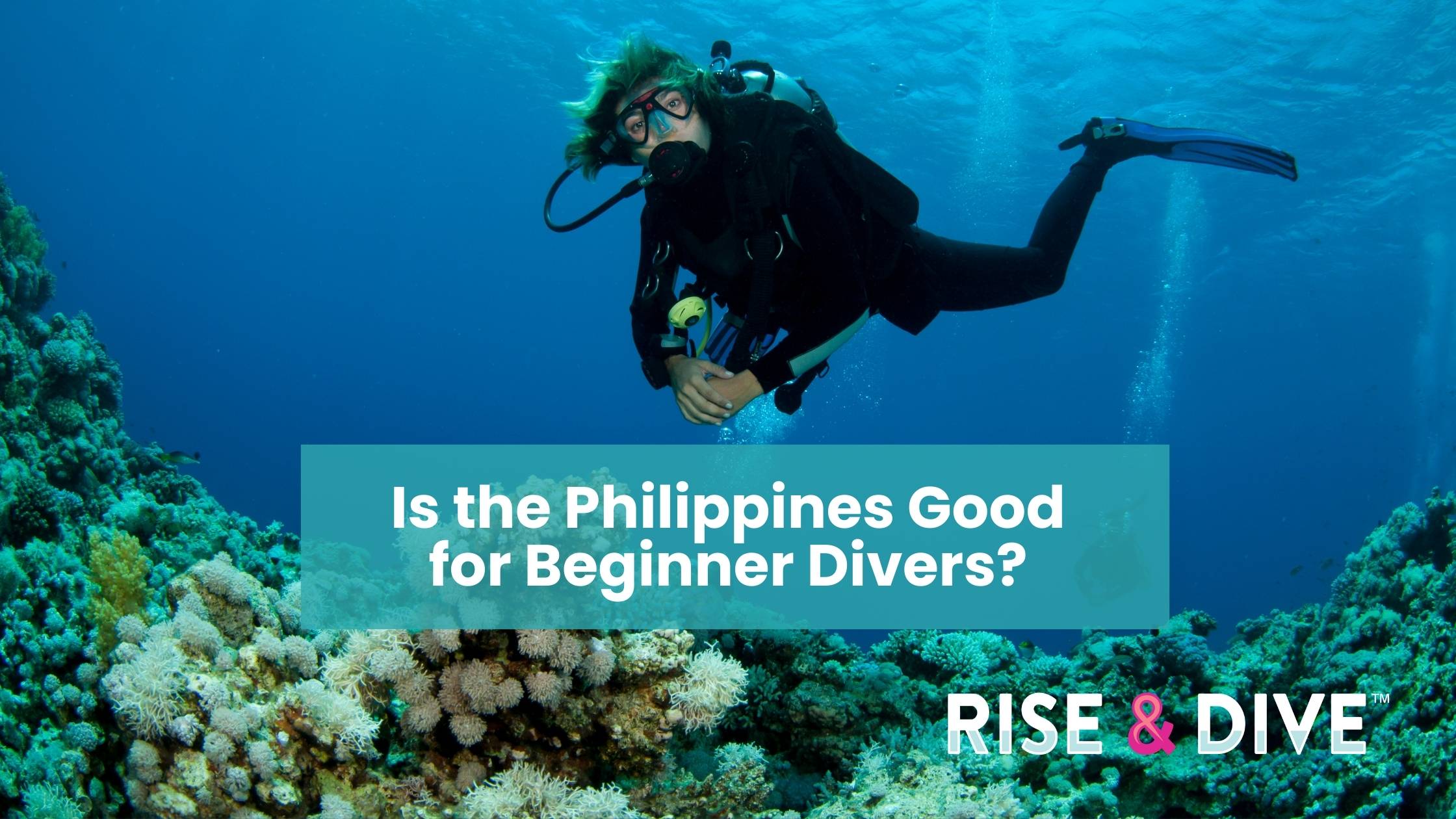 Beginner scuba diver hovering calmly above a coral reef in the Philippines