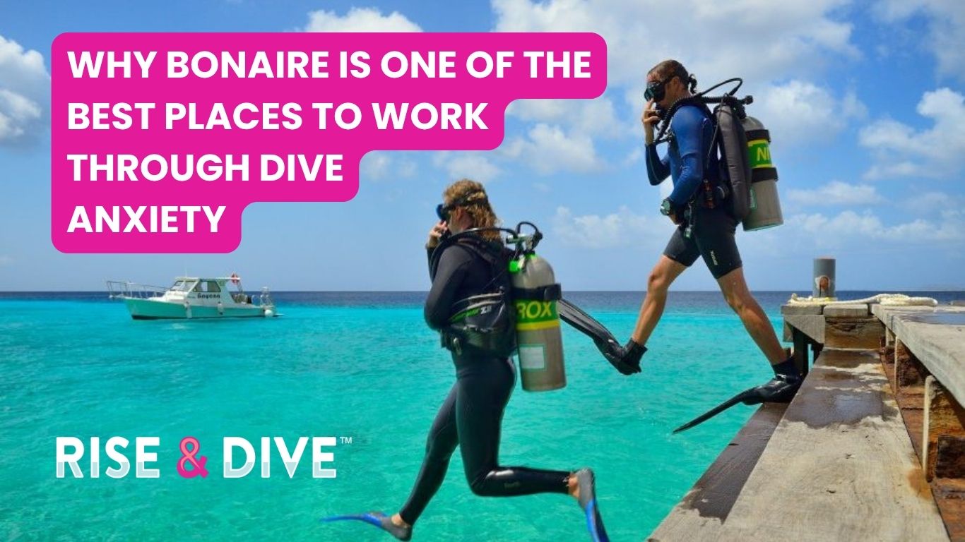 Two scuba divers stepping off calmly in clear water over a reef reducing dive anxiety Bonaire
