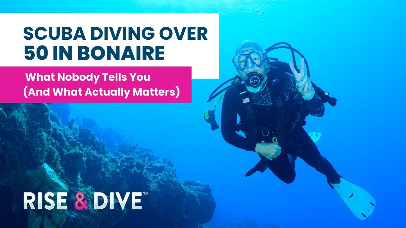 Women over 50 scuba diving calmly in clear water in Bonaire