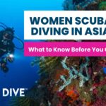 Scuba diver swimming through a vibrant coral reef in the Philippines Coral Triangle during a women scuba diving Asia trip
